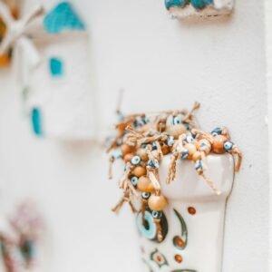 Artistic close-up of ceramic wall decor with vibrant beads creating a charming aesthetic.